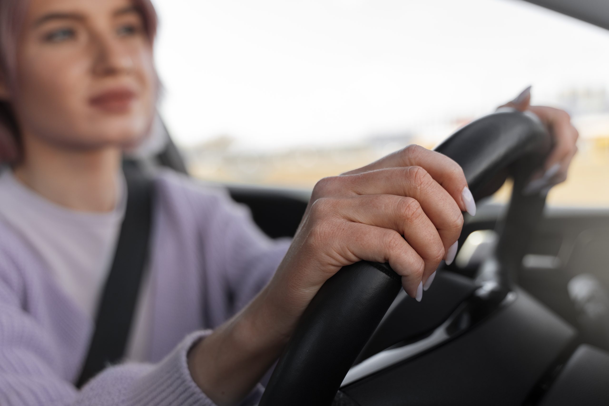 woman driving car test get driver s license scaled